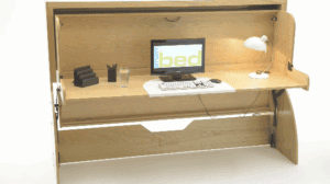 A compact wooden study bed with integrated desk, computer workstation, and storage shelves designed for efficient space use in modern home offices or small bedrooms.
